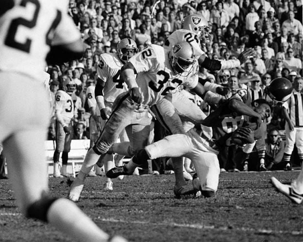 1977 Oakland Raiders Jack Tatum Hits Sammy White Glossy Photo Print Poster