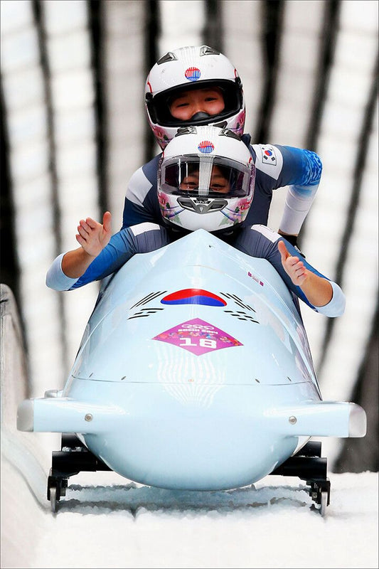 Bobsled Team In Front Of Bobsled Jigsaw Puzzle