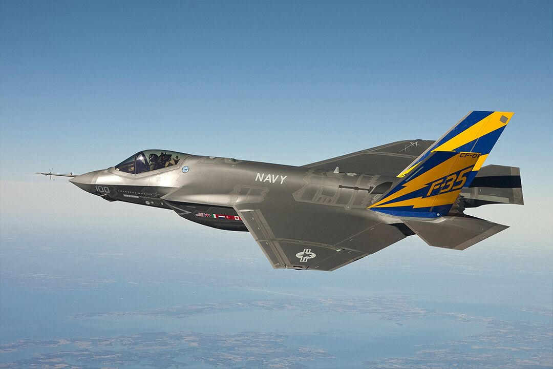 Gray Blue And Yellow Navy F 35 Fighter Jet Flying In The Sky Jigsaw Puzzle
