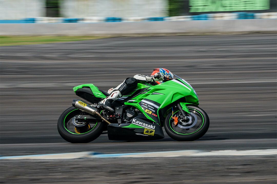Kawasaki Man Riding On Green Sports Bike Keychain