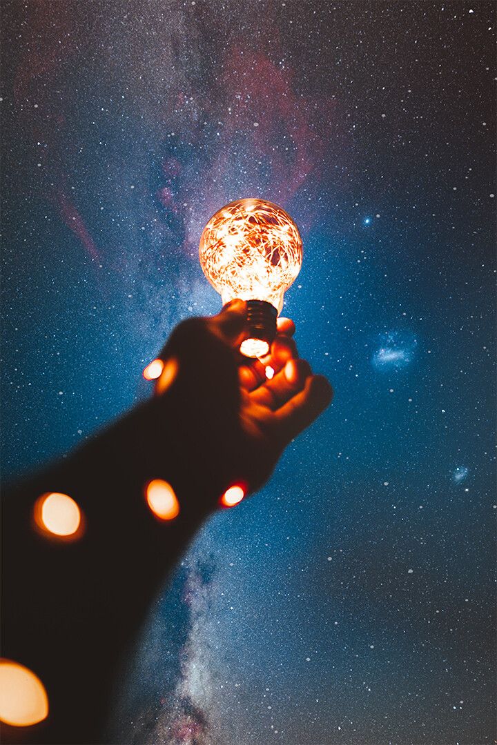 Person Holding Light Bulb With String Lights Inside Wall Decor Jigsaw Puzzle
